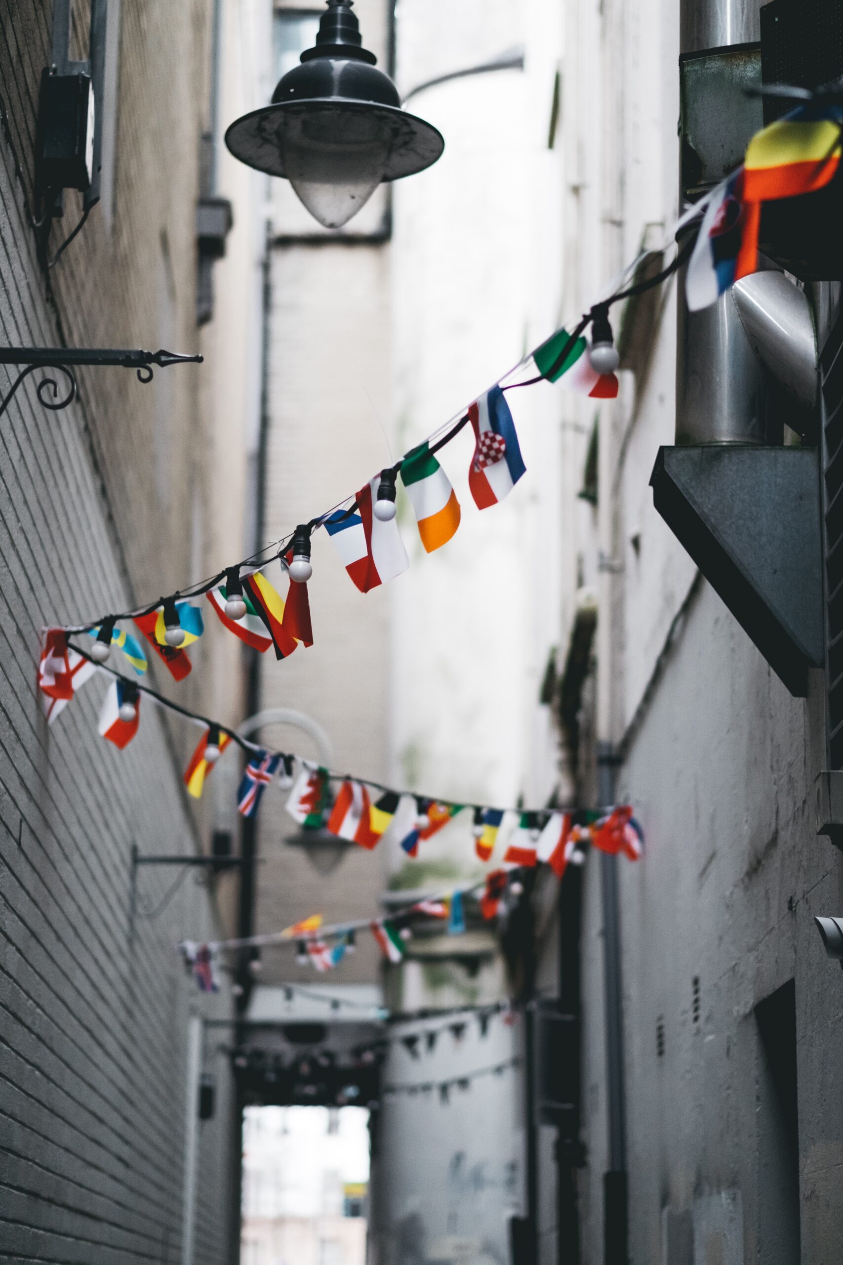 flags hanging on a street